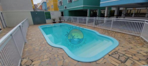 Apartamento com Piscina no Centro da praia Próximo a Praia e Comércio em Geral